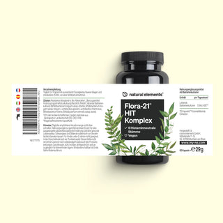 Eine schwarze Flasche mit der Aufschrift „Flora-21 HIT Komplex“ von natural elements, mit einem weißen Etikett mit grünen Blättern und deutschem Text.